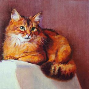 Кошка на спинке кресла